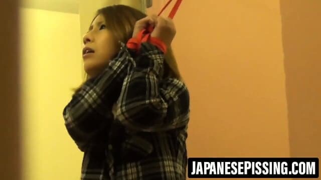 Bullied Japanese girl tied to pole soaking herself in despair