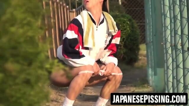 Three naughty Japanese schoolgirls peeing together in stall