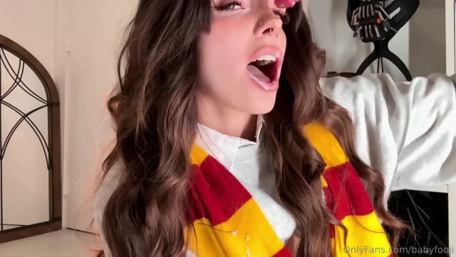 Cosplayers playing with a dildo