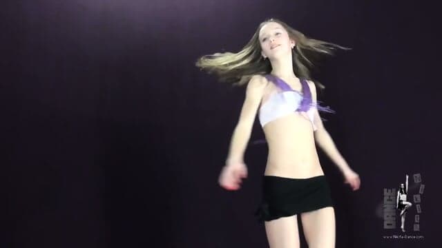 Nikita dancing in a black micro mini skirt
