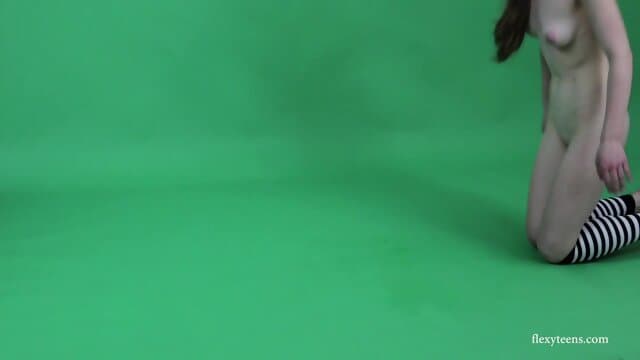 Young brunette gymnast Anna Mostik spreading legs